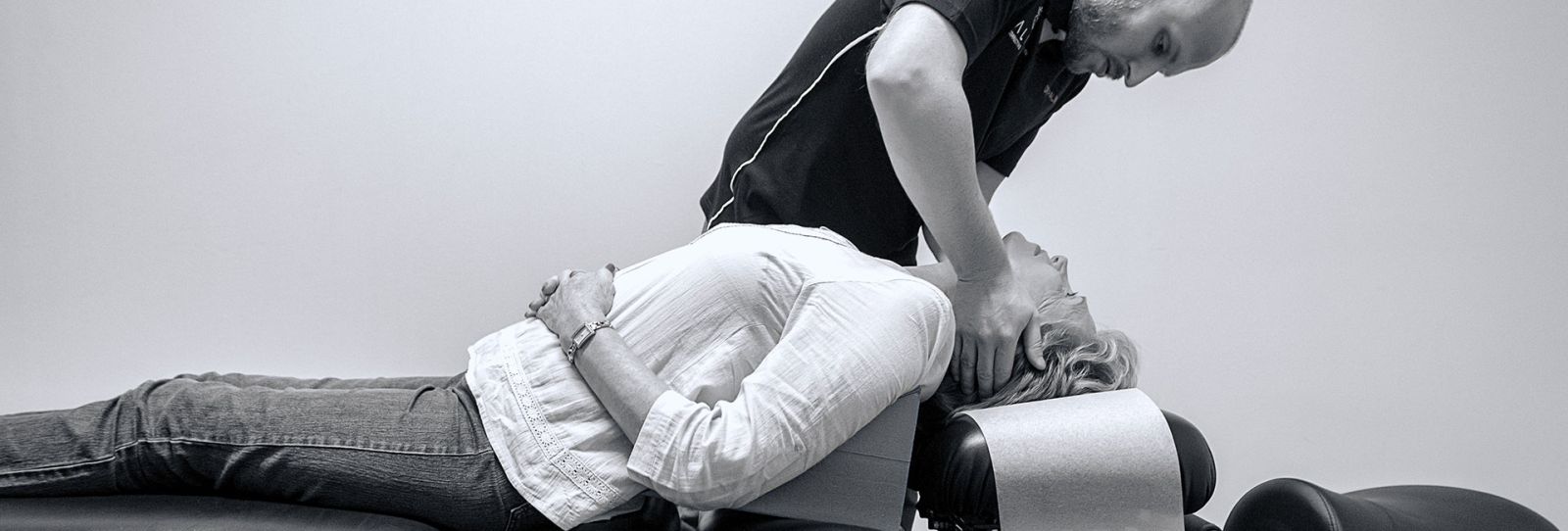 Dr David Palmer performing a spinal adjustment on a patient at Align Corrective Chiropractic in Durban North